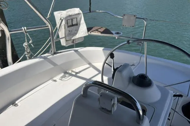 Slide: The Image of Cockpit of a 2000 Hunter 340 sailboat with steering wheel and ocean view. - 15
