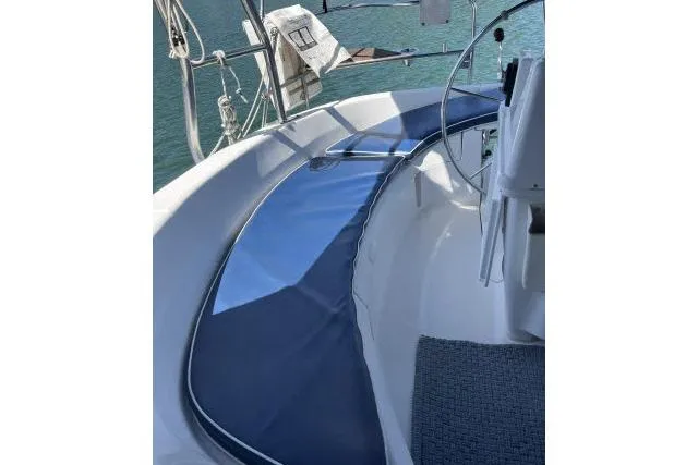 Slide: The Image of Cockpit view of a 2000 Hunter 340 sailboat with blue seating cover. - 16