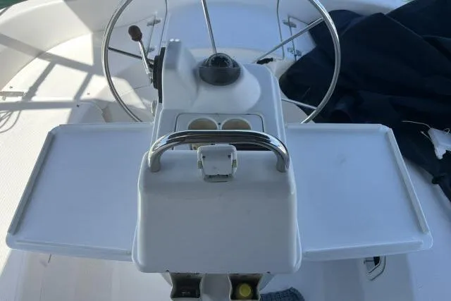 Slide: The Image of Cockpit of 2000 Hunter 340 sailboat with steering wheel and navigation instruments. - 17
