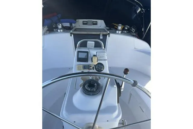 Slide: The Image of Cockpit view of a 2000 Hunter 340 sailboat with steering wheel and navigation instruments. - 20