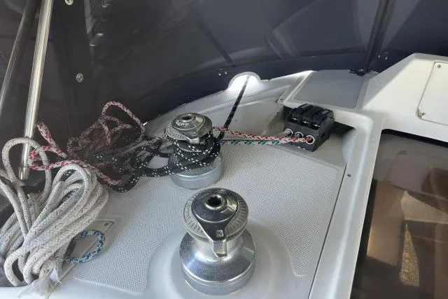 Slide: The Image of Deck of 2000 Hunter 340 sailboat with winches and ropes. - 22