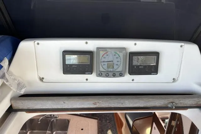 Slide: The Image of Control panel of a 2000 Hunter 340 sailboat with navigation instruments. - 23