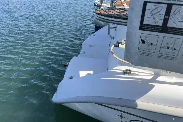 Slide: The Image of Hunter 340 sailboat from 2000 docked on calm water. - 30