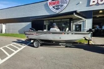 Slide: The Image of 2008 Tracker Pro Guide V-16 SC boat on trailer outside Power Pros building. - 4