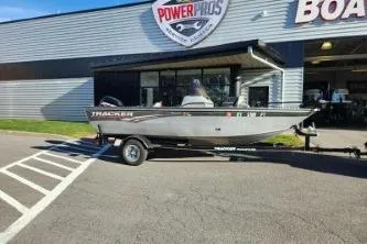 Slide: The Image of 2008 Tracker Pro Guide V-16 SC boat on trailer outside dealership. - 6