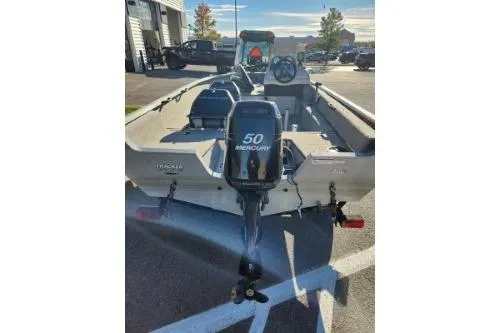 Slide: The Image of 2008 Tracker Pro Guide V-16 SC boat with Mercury 50 engine in parking lot. - 7