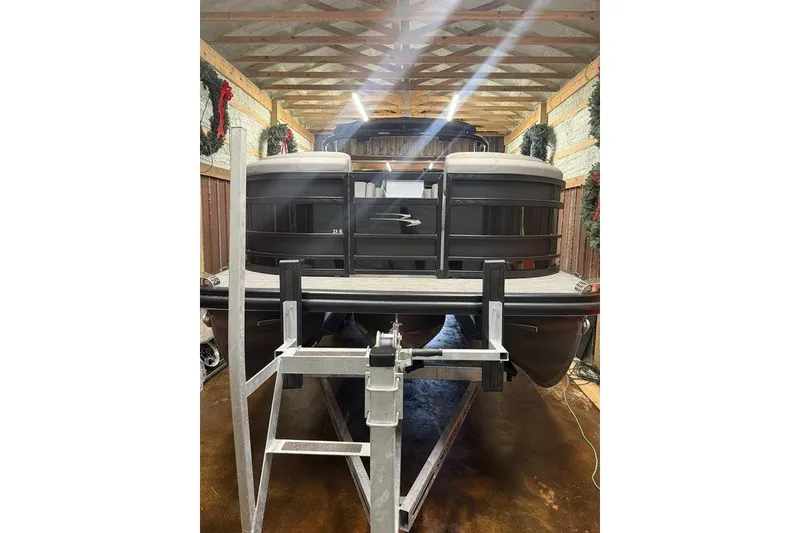 Slide: The Image of 2023 Bennington 23 RSBWA pontoon boat in storage, front view. - 4