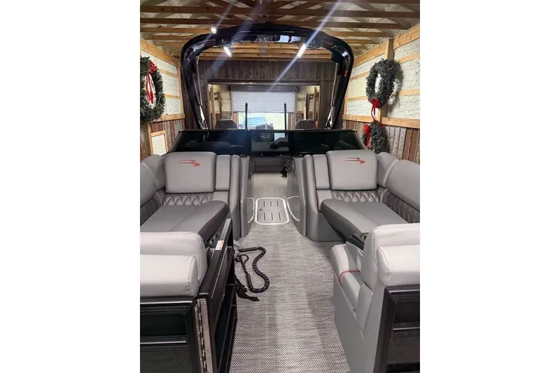 Slide: The Image of 2023 Bennington 23 RSBWA pontoon boat interior with luxurious seating and modern design. - 5