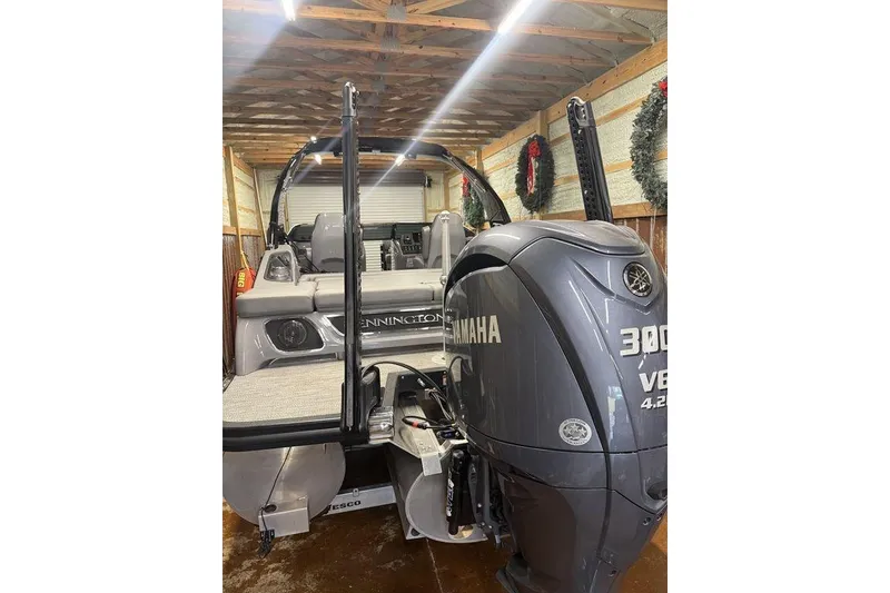 Slide: The Image of 2023 Bennington 23 RSBWA pontoon boat with Yamaha 300 V6 engine in a garage. - 7