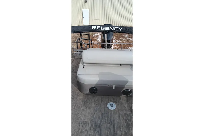 Slide: The Image of 2024 Ranger 2500LS boat interior with beige seating and REGENGY branding. - 31