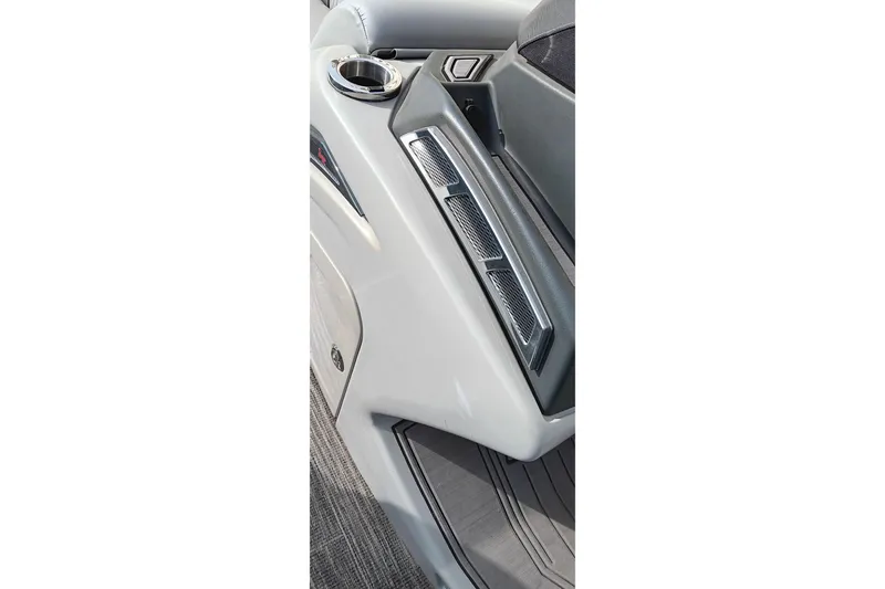Slide: The Image of 2024 Ranger 2500LS boat interior detail with cup holder and sleek design. - 42
