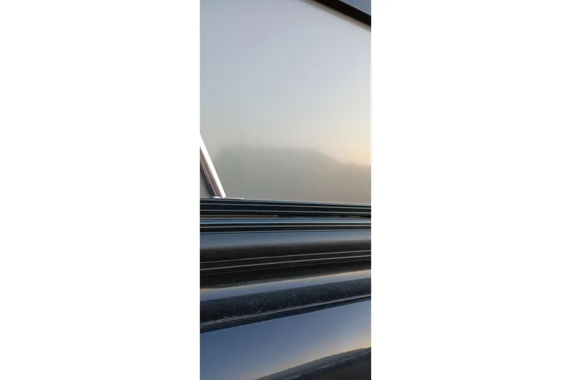 Slide: The Image of 2024 Ranger 2500LS boat detail with sleek metallic finish and reflective surface. - 51