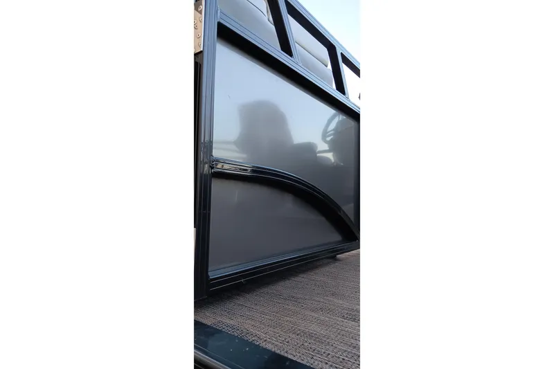 Slide: The Image of 2024 Ranger 2500LS boat side view with sleek black panel design. - 52