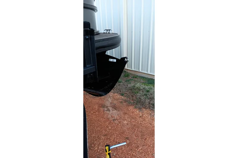 Slide: The Image of 2024 Ranger 2500LS boat trailer hitch near metal building. - 68
