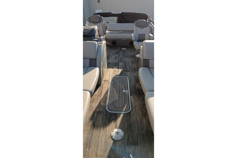 Slide: The Image of 2024 Ranger 2500LS boat interior with spacious seating and modern flooring. - 77