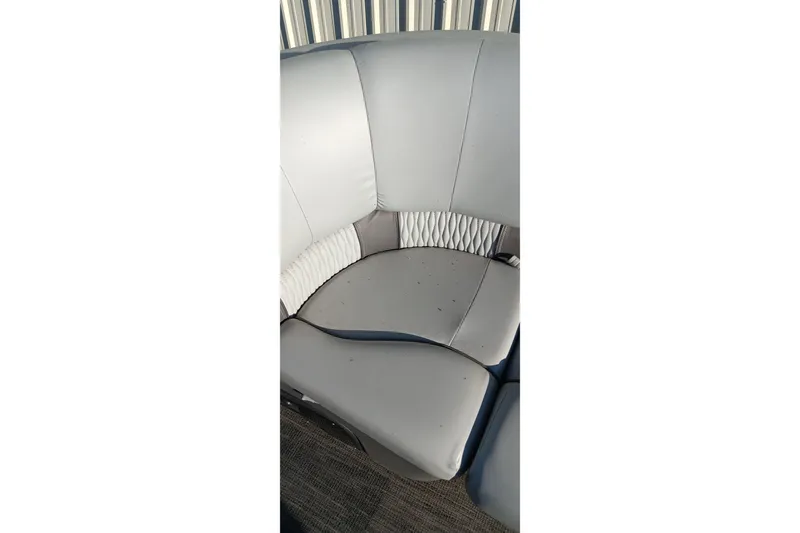 Slide: The Image of 2024 Ranger 2500LS boat seat with white and gray upholstery. - 88