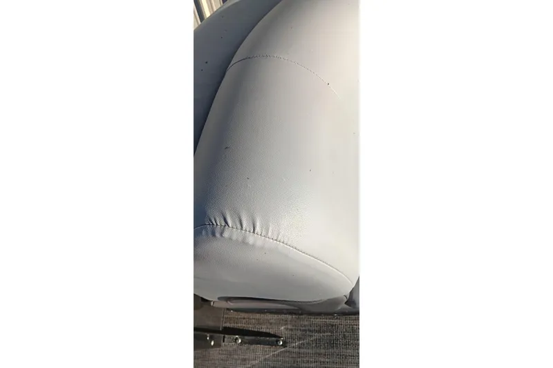 Slide: The Image of Close-up of 2024 Ranger 2500LS boat seat upholstery, showcasing stitching details. - 89