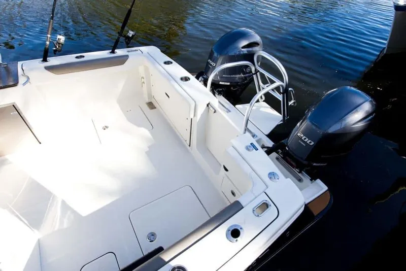 Slide: The Image of Manufacturer Provided Image: 2026 World Cat 280 DC-X boat with dual engines on calm water. - 11