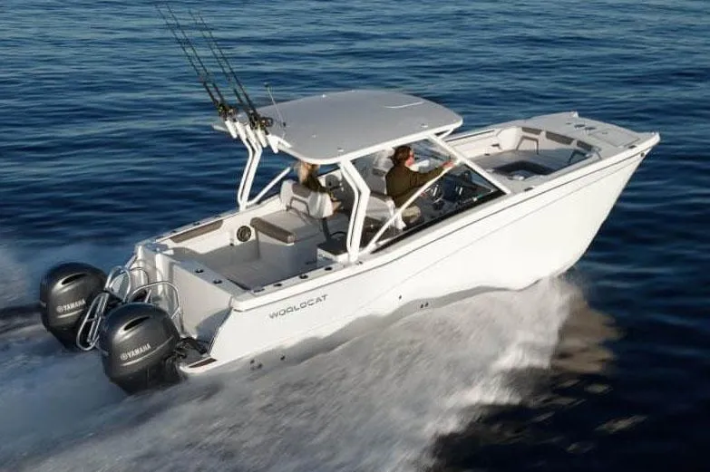 Slide: The Image of Manufacturer Provided Image: 2026 World Cat 280 DC-X boat cruising on open water, featuring dual Yamaha engines. - 2