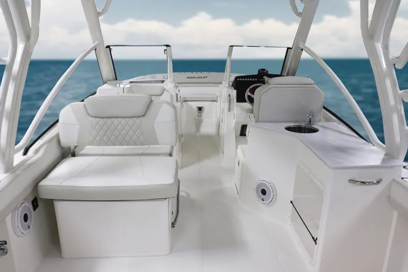 Slide: The Image of Manufacturer Provided Image: 2026 World Cat 280 DC-X boat interior with white seating and ocean view. - 6