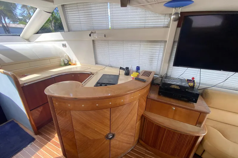Slide: The Image of Interior of 1998 Azimut 52 yacht with modern kitchen and entertainment area. - 29