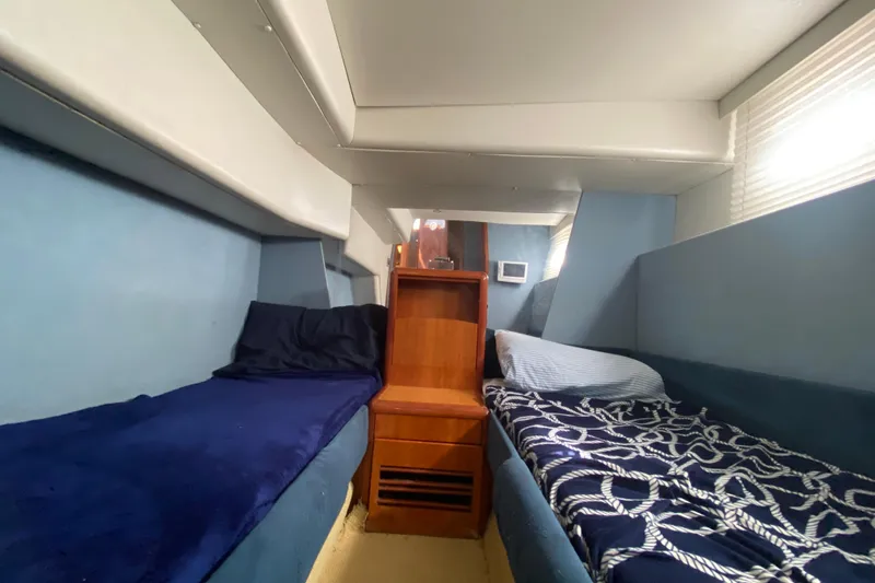 Slide: The Image of Interior cabin of a 1998 Azimut 52 yacht with twin beds and nautical decor. - 37