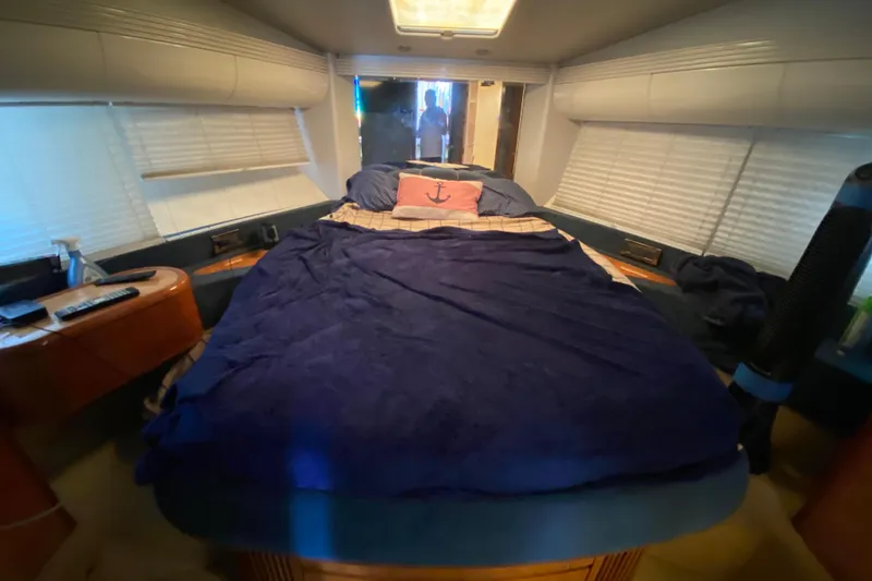 Slide: The Image of Luxurious bedroom interior of a 1998 Azimut 52 yacht with cozy bedding. - 41