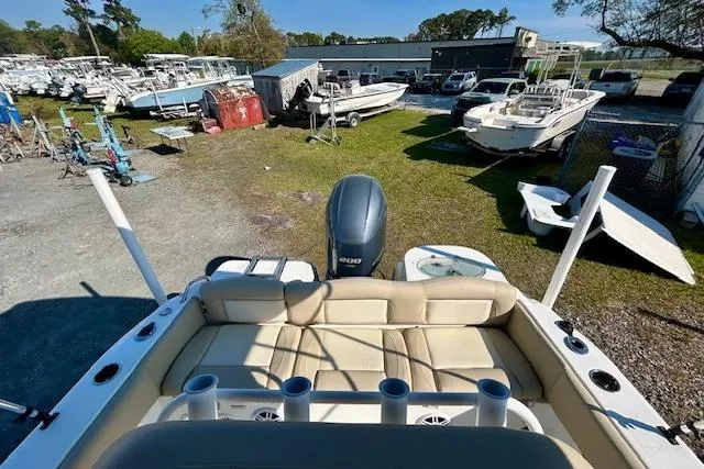 Slide: The Image of 2022 NauticStar 2102 Legacy boat with seating and motor, in a boatyard setting. - 3
