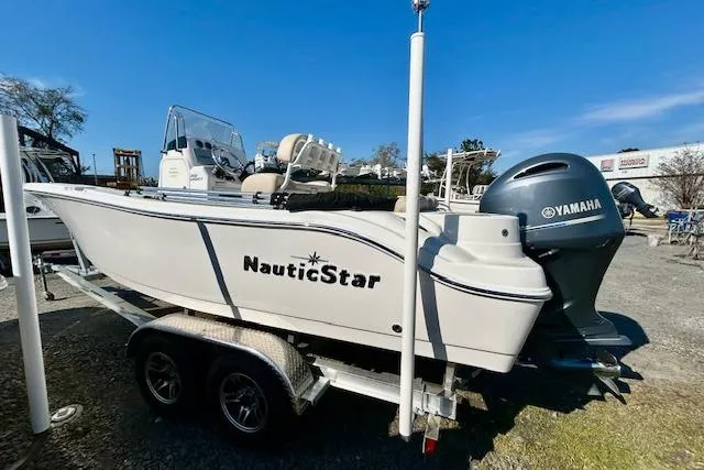 Slide: The Image of 2022 NauticStar 2102 Legacy boat on trailer with Yamaha engine. - 9