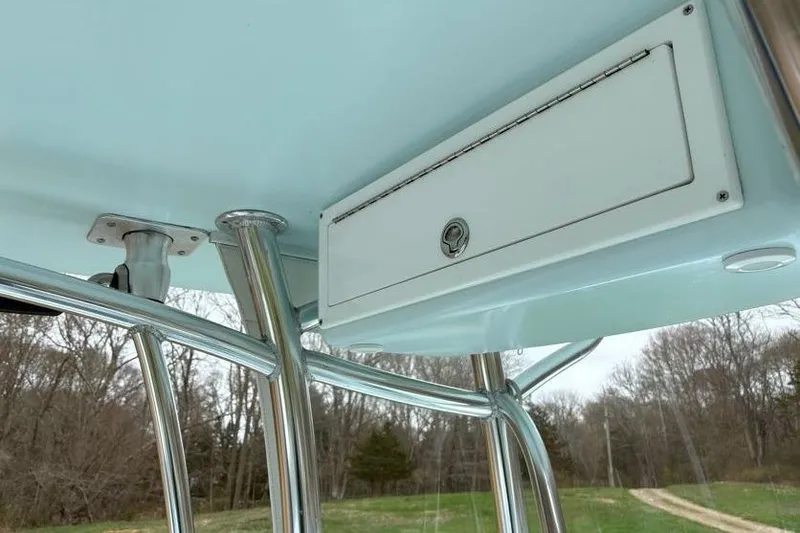 Slide: The Image of 2019 Stoner 23 CC boat with stainless steel T-top and storage compartment. - 15