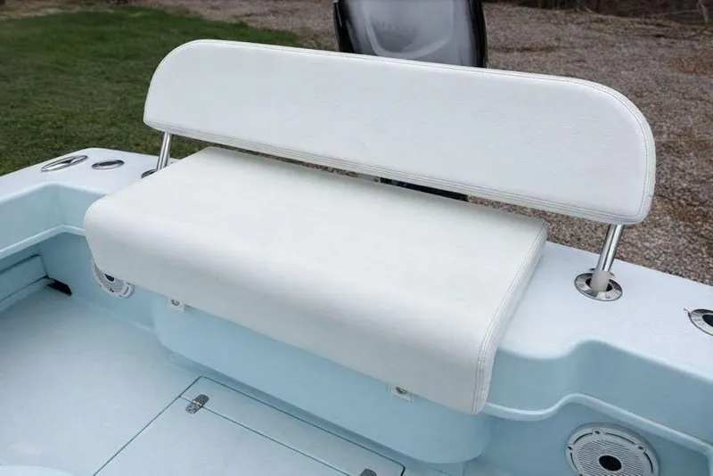 Slide: The Image of White cushioned seat on 2019 Stoner 23 CC boat, outdoor setting. - 4