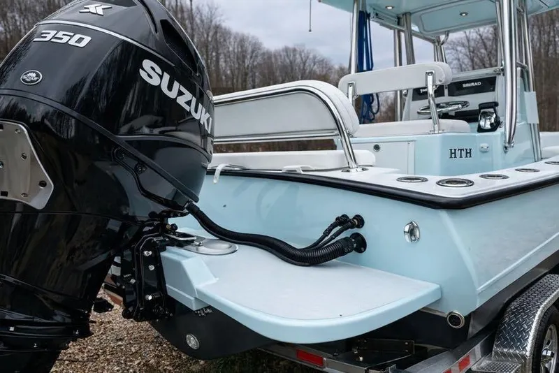 Slide: The Image of 2019 Stoner 23 CC boat with Suzuki 350 outboard motor, light blue hull. - 7