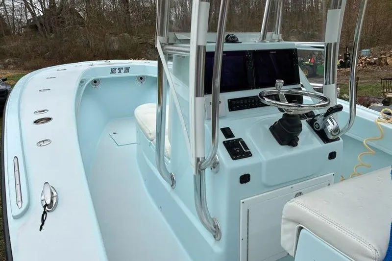 Slide: The Image of 2019 Stoner 23 CC boat with modern helm and navigation equipment. - 8