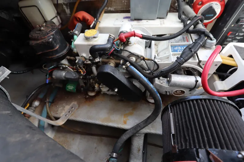 Slide: The Image of Engine compartment of a 2002 Mainship Pilot 34 boat, showcasing mechanical components. - 40
