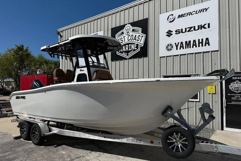 The Image of 2026 Sea Pro 242 Center Console boat on trailer at West Coast Marine dealership. - 1