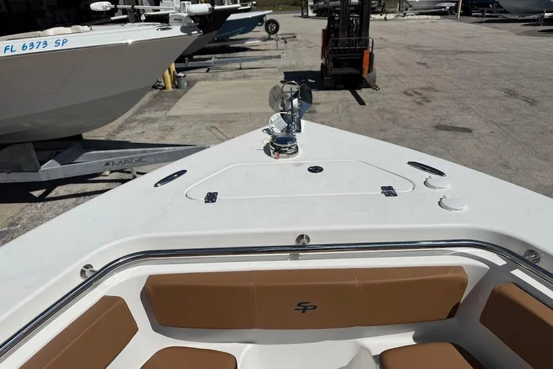 Slide: The Image of 2026 Sea Pro 242 Center Console boat with tan seating and deck view. - 17