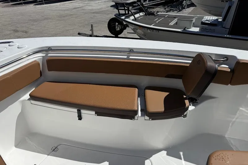Slide: The Image of 2026 Sea Pro 242 Center Console boat with brown cushioned seating in the bow area. - 18