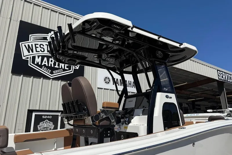 Slide: The Image of 2026 Sea Pro 242 Center Console boat at West Coast Marine dealership. - 21