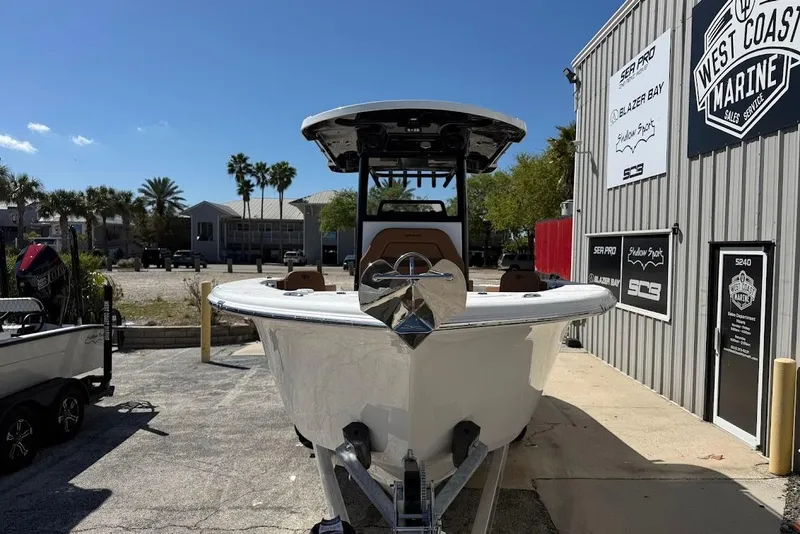 Slide: The Image of 2026 Sea Pro 242 Center Console boat displayed at West Coast Marine dealership. - 3