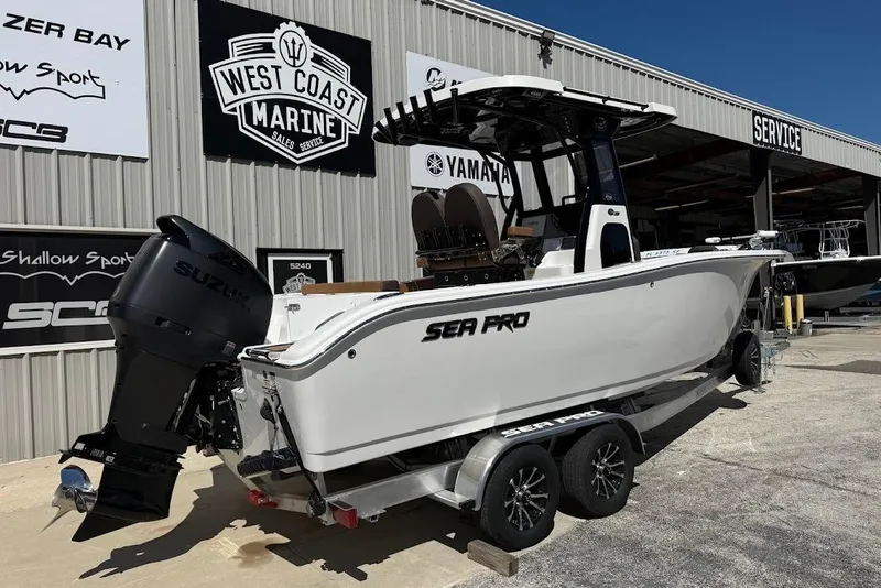 Slide: The Image of 2026 Sea Pro 242 Center Console boat at West Coast Marine dealership. - 6