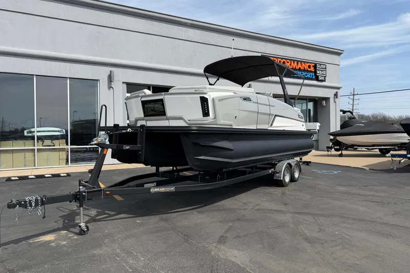 The Image of 2025 Balise HORIZON 24C boat on trailer outside dealership. - 1