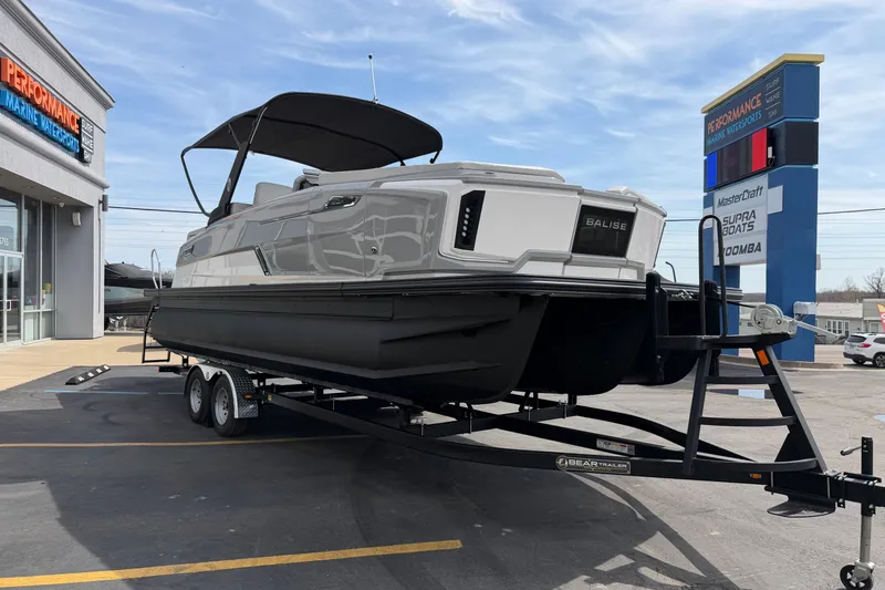 Slide: The Image of 2025 Balise HORIZON 24C boat on trailer at Performance Marine Watersports dealership. - 11