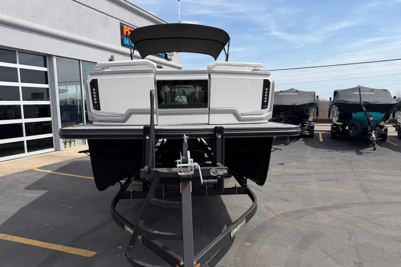 Slide: The Image of 2025 Balise HORIZON 24C boat on trailer at dealership parking lot. - 14