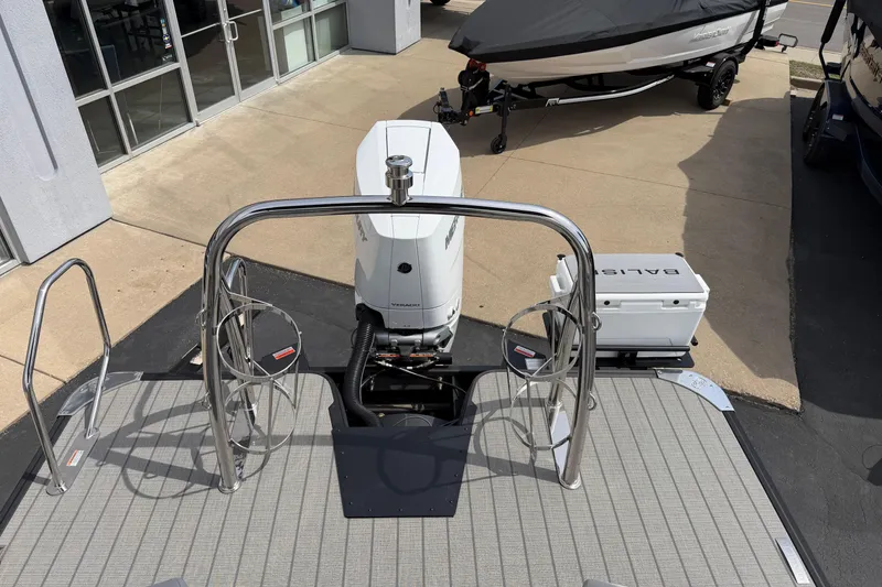 Slide: The Image of Balise HORIZON 24C boat with outboard motor, docked near showroom, 2025 model. - 17