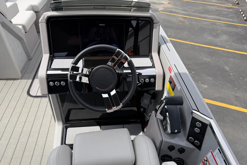 Slide: The Image of Cockpit of 2025 Balise HORIZON 24C boat with modern steering and controls. - 25