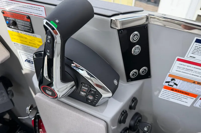 Slide: The Image of Control panel of a 2025 Balise HORIZON 24C boat with throttle and warning labels. - 26