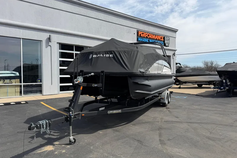 Slide: The Image of 2025 Balise HORIZON 24C boat on trailer, covered, outside marine dealership. - 35