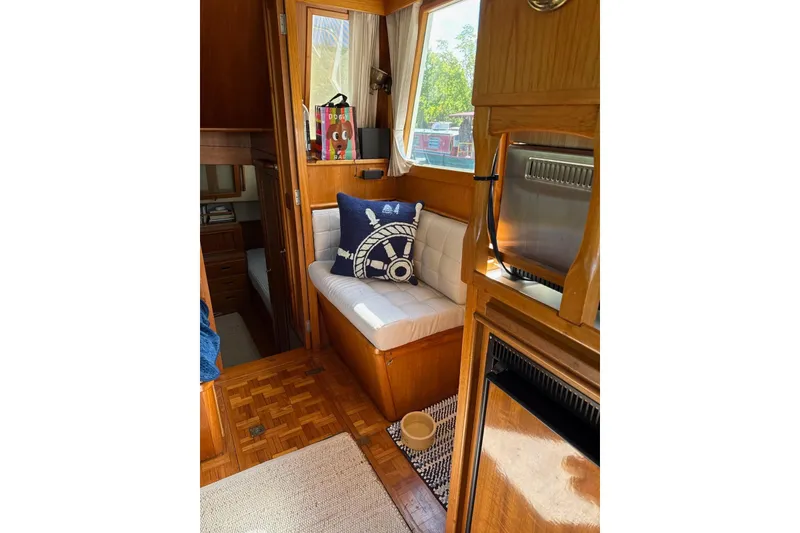 Slide: The Image of Cozy interior of 1989 Grand Banks 36 Classic yacht with nautical-themed decor. - 10