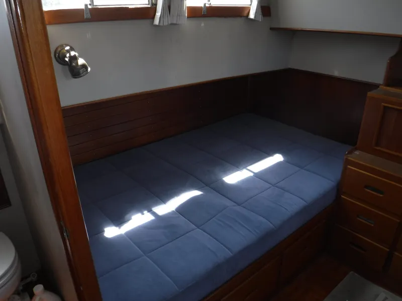 Slide: The Image of Interior of 1989 Grand Banks 36 Classic with blue mattress. - 12
