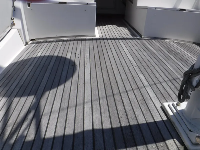 Slide: The Image of Deck of a 1989 Grand Banks 36 Classic with wooden flooring. - 22